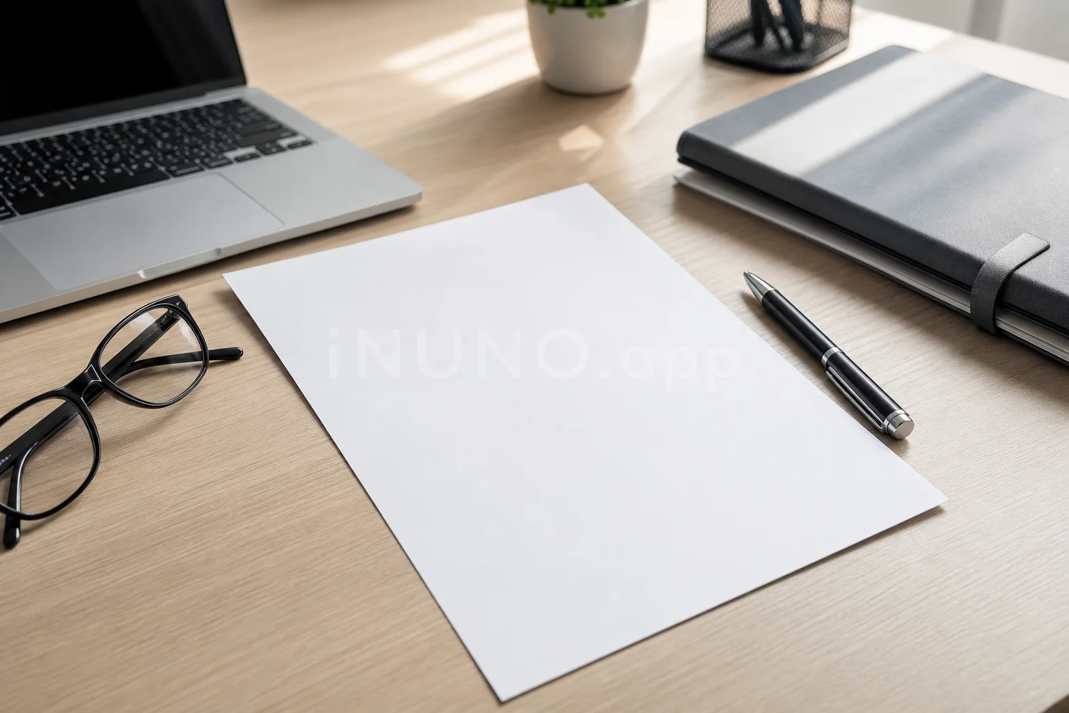 Professional desk with resume notes and laptop